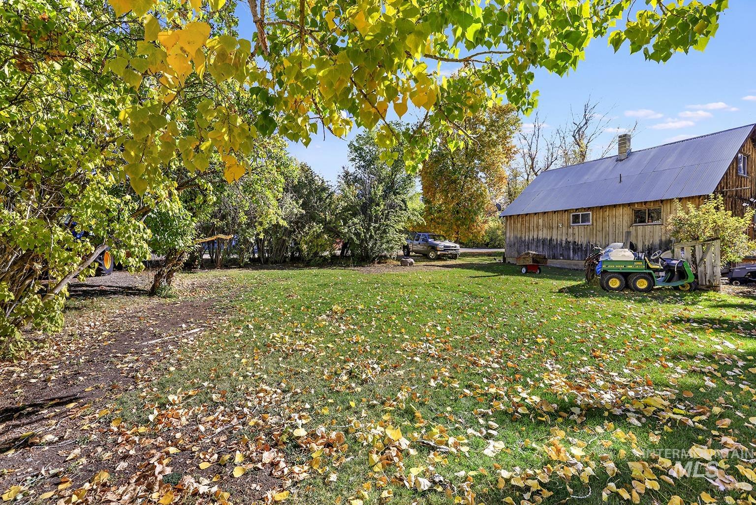 View of grassy yard with an outdoor structure
