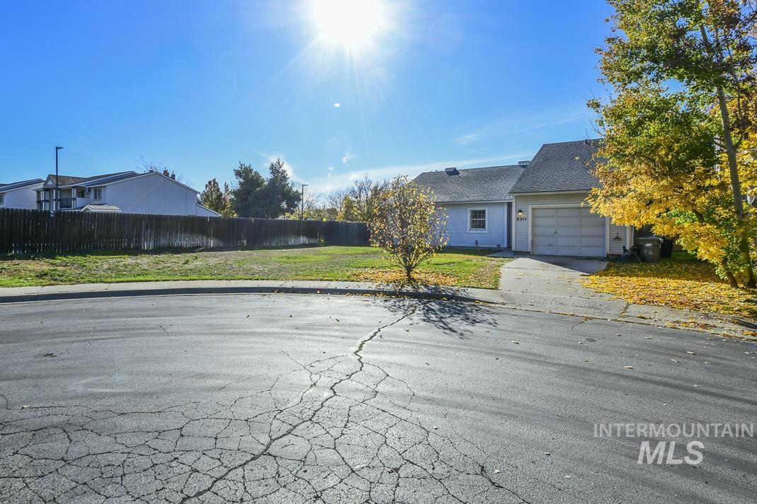 View of front of house featuring concrete driveway and an attached garage