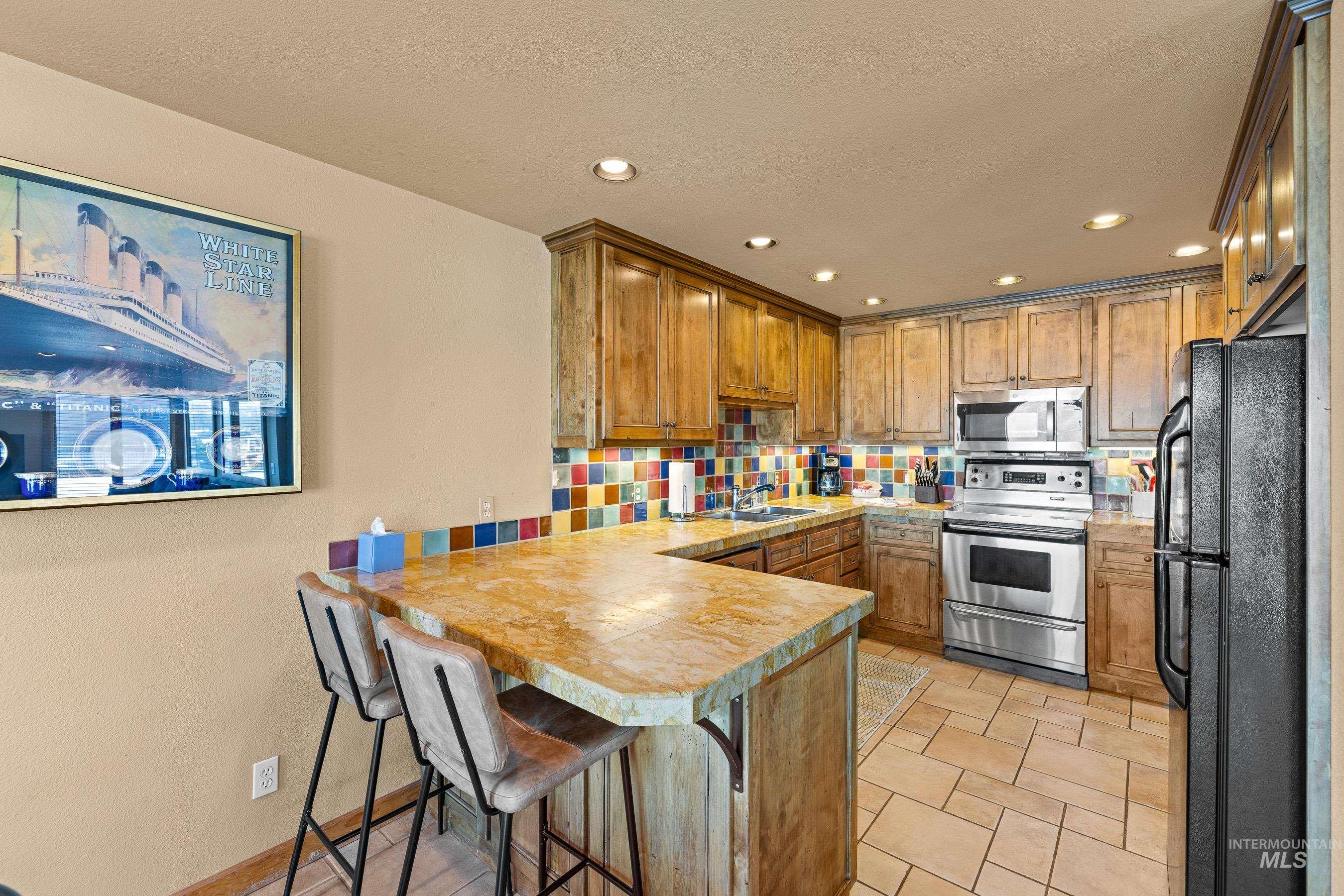 Kitchen with stainless steel appliances & granite counter tops