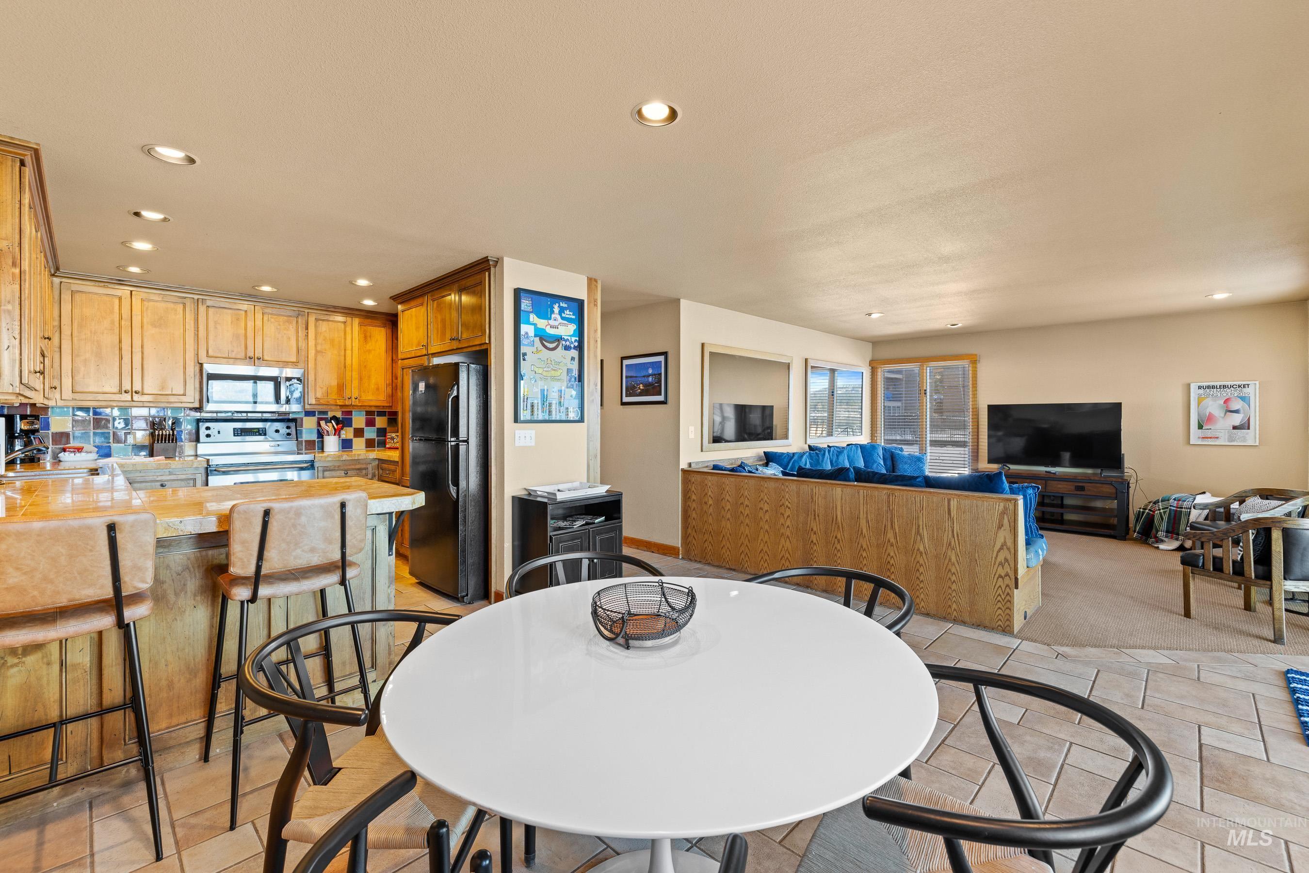 Dining space with recessed lighting, heated tile floors