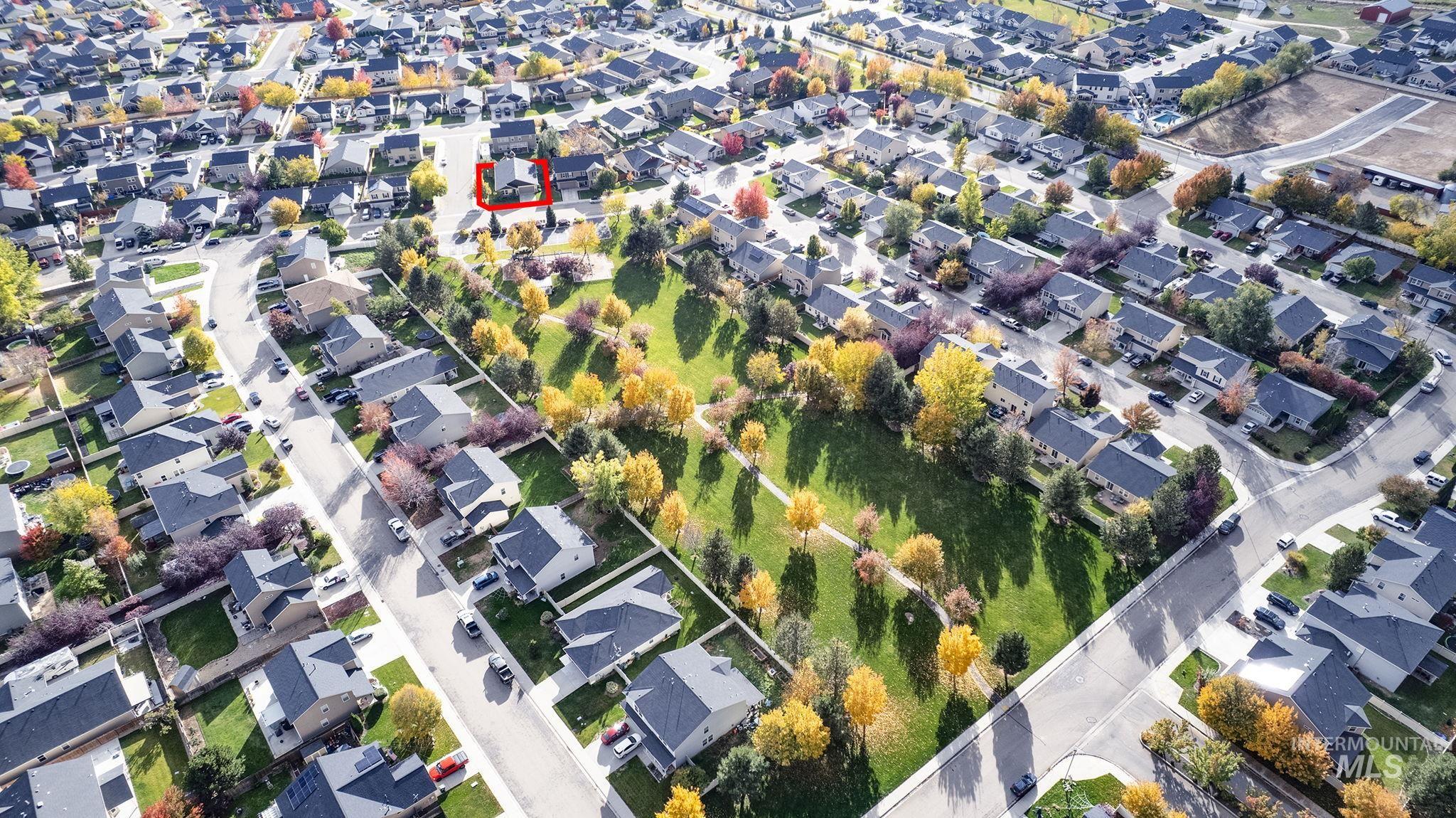 Aerial overview of property's location featuring nearby suburban area