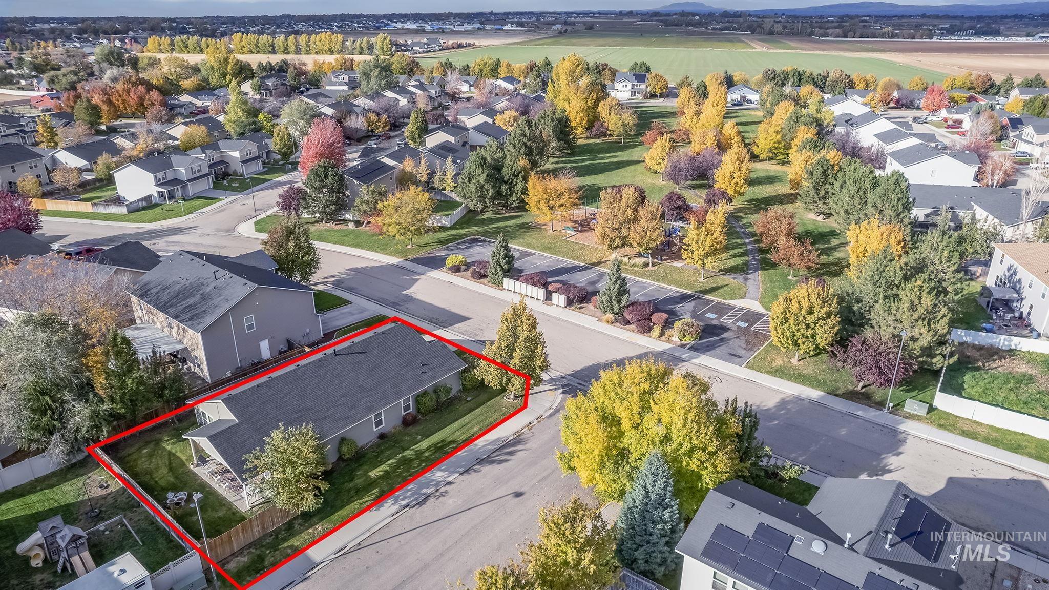 Aerial perspective of suburban area featuring property boundaries highlighted