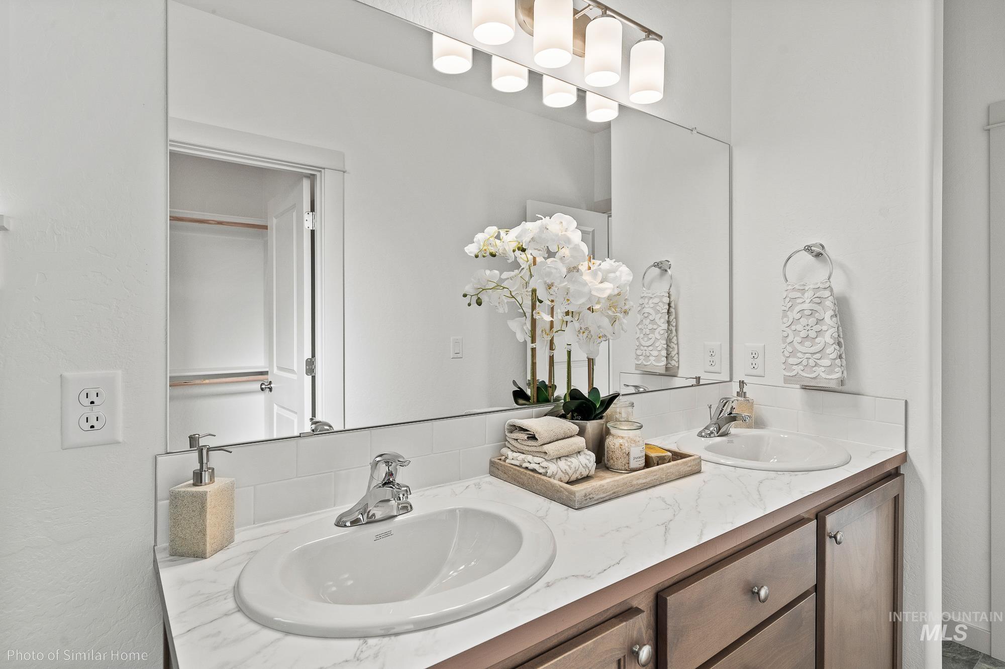 Bathroom featuring double vanity