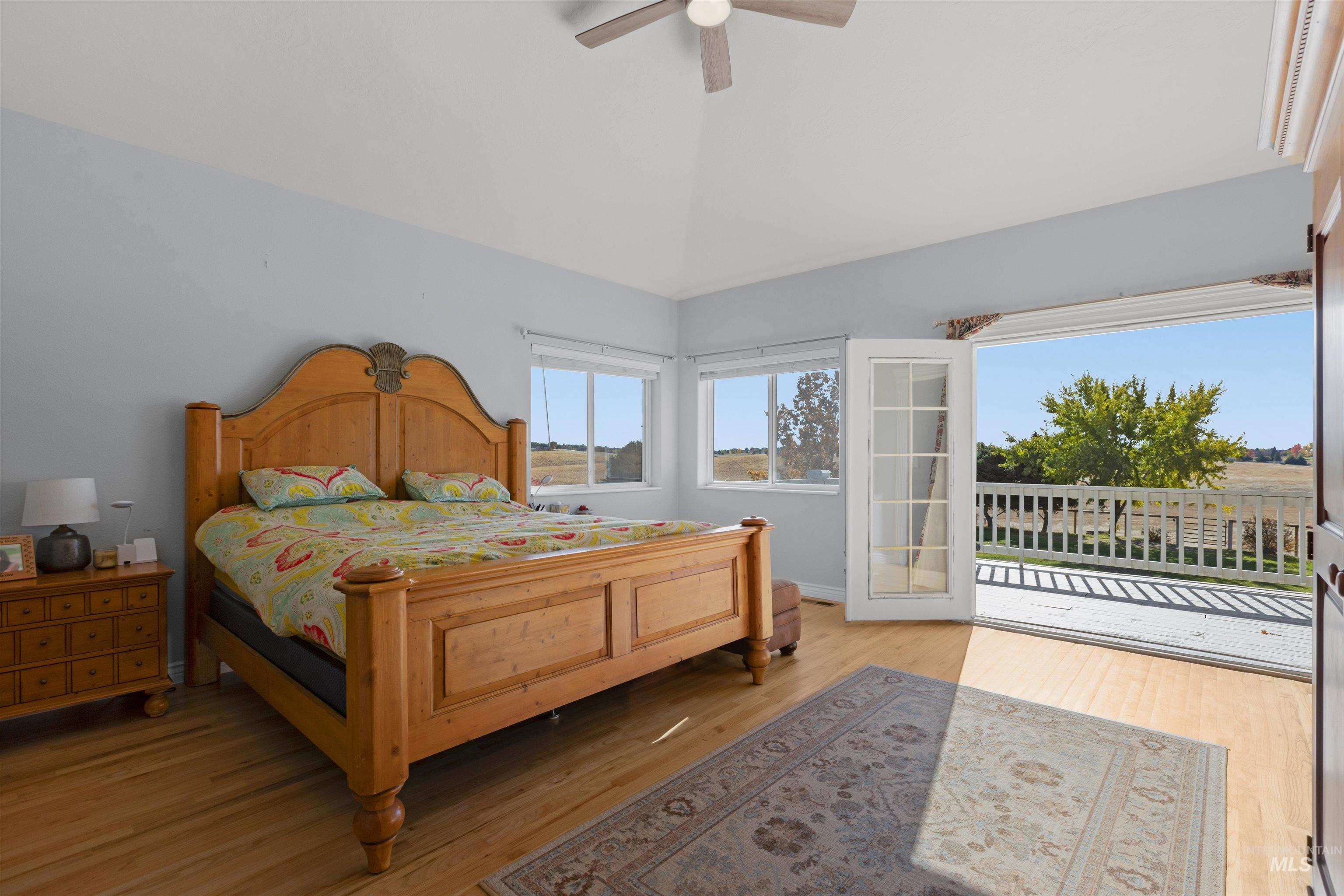 Bedroom featuring light wood-type flooring and a ceiling fan