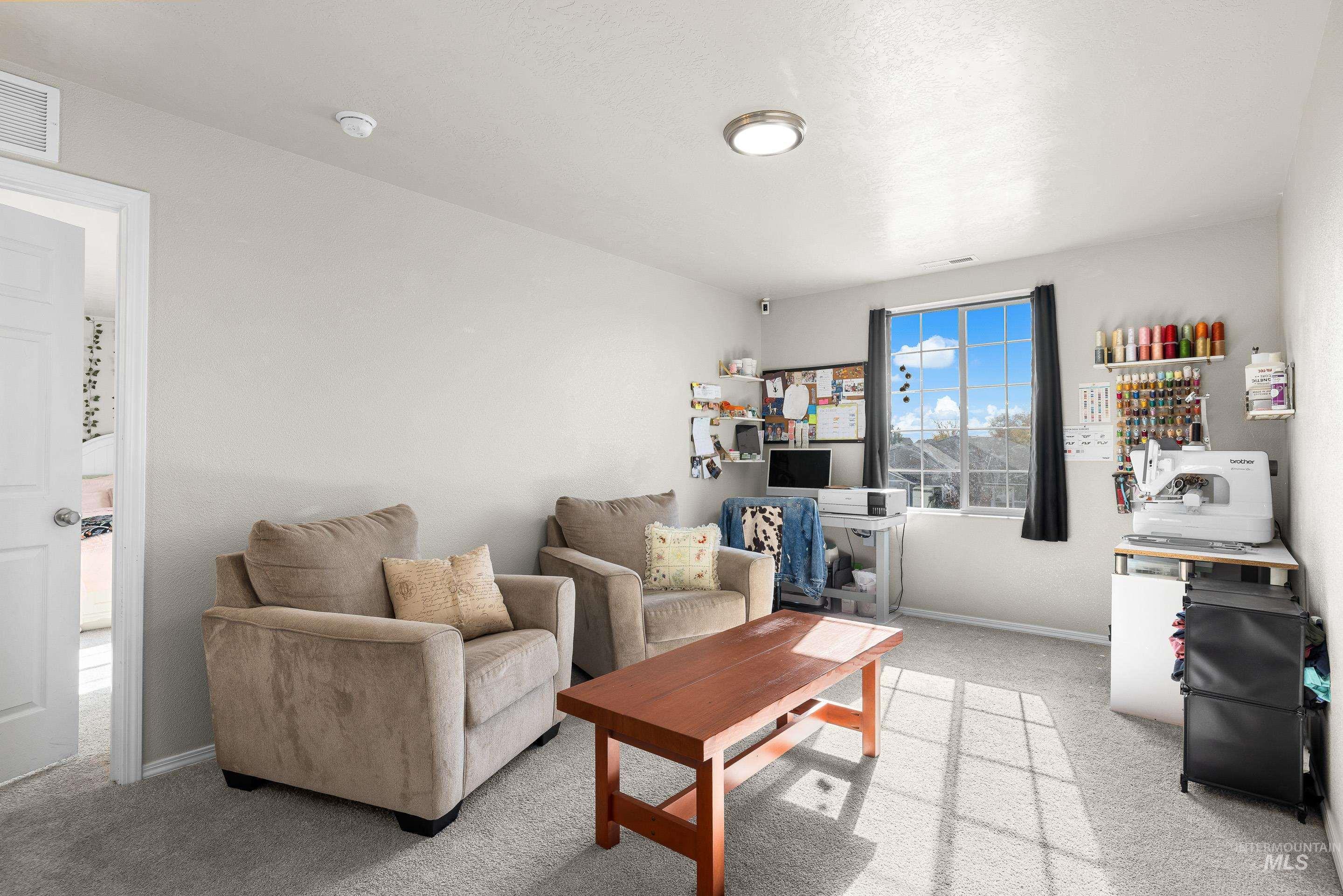 Living room with light colored carpet