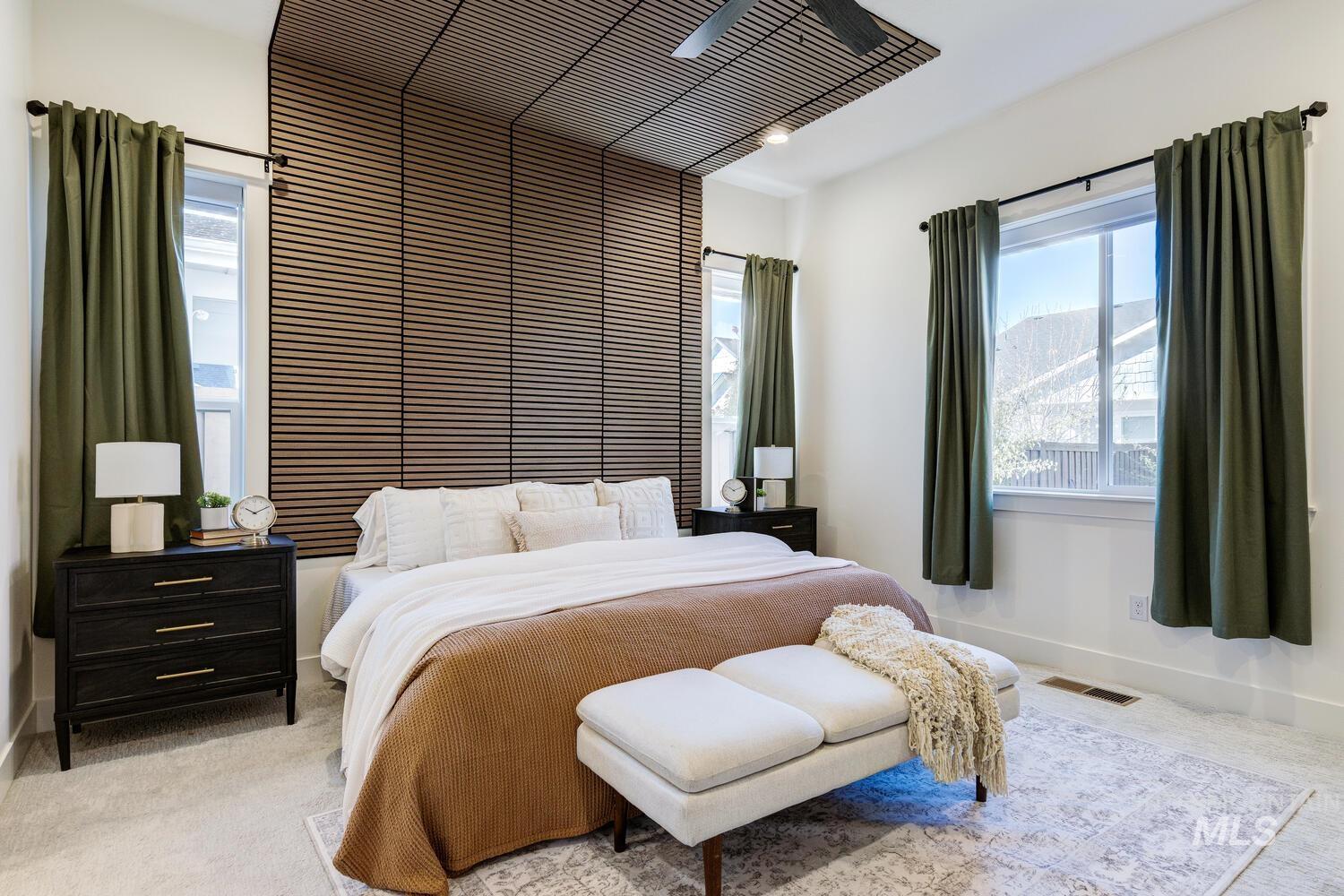 Carpeted bedroom with baseboards