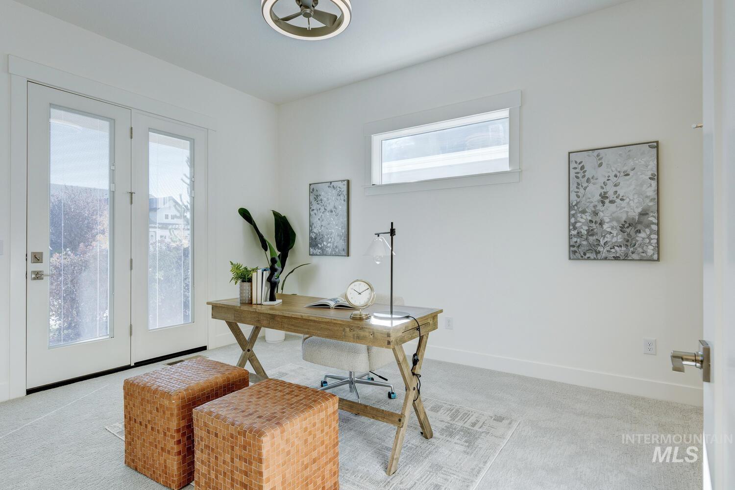Office area with carpet flooring and baseboards