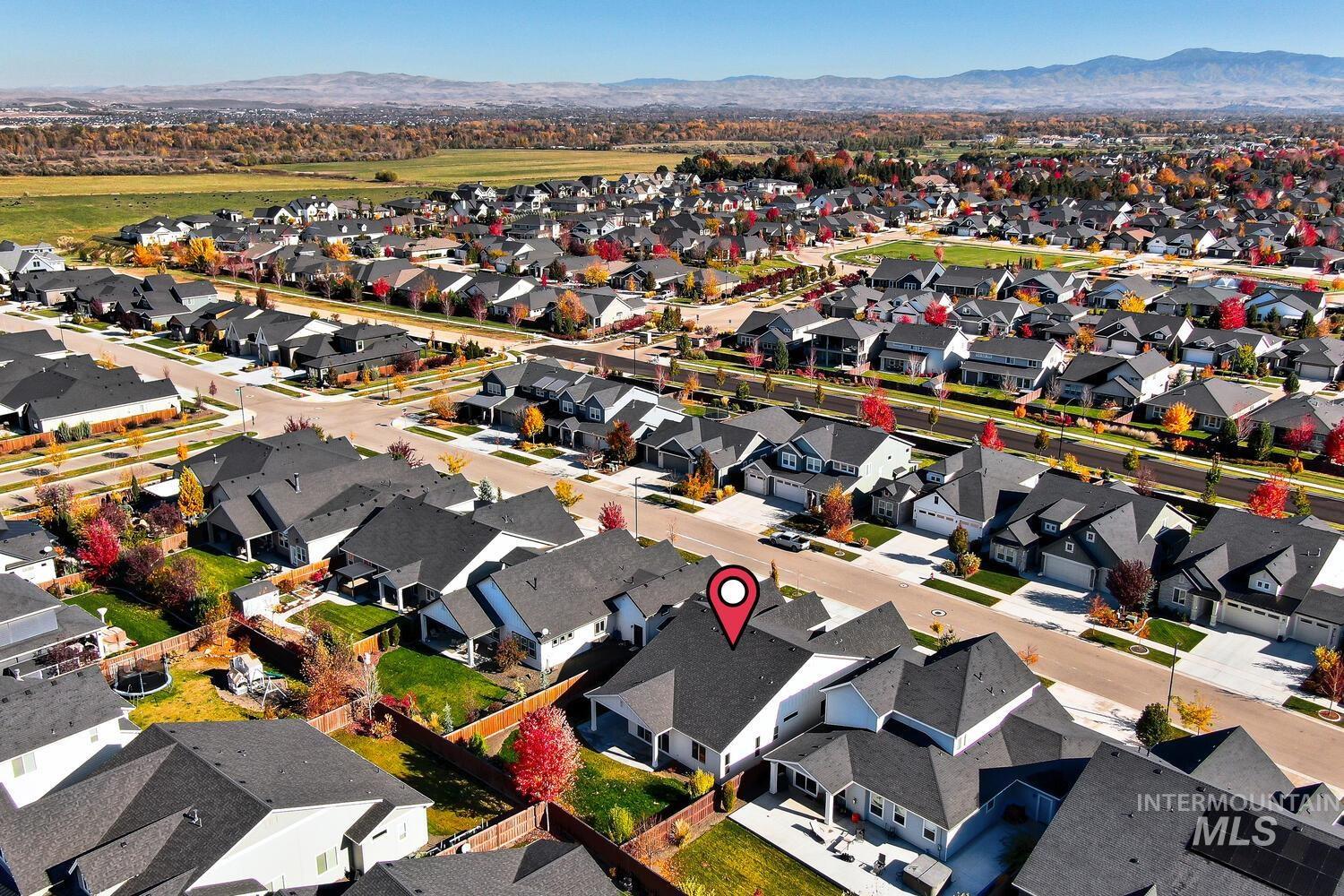 Aerial view of residential area featuring mountains
