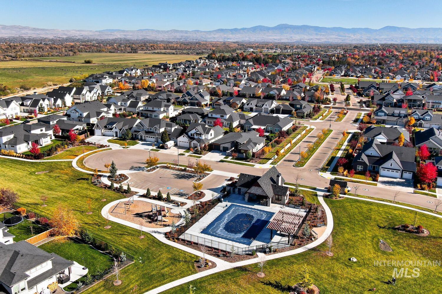 Aerial view of residential area featuring mountains