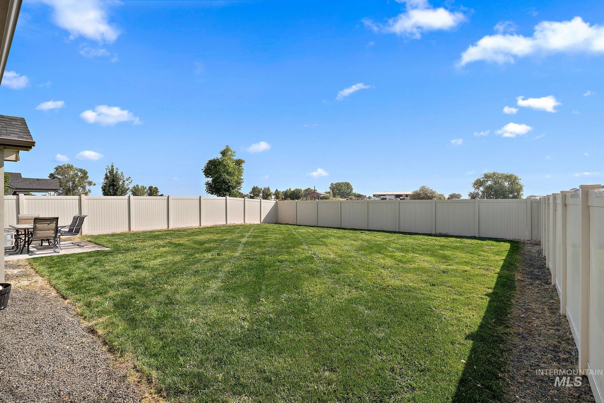 Fenced backyard featuring a patio area