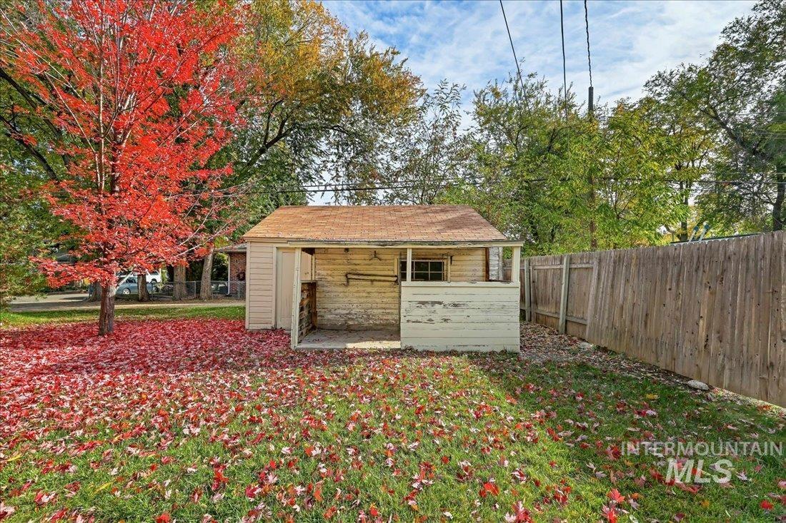 View of outdoor structure with a fenced backyard