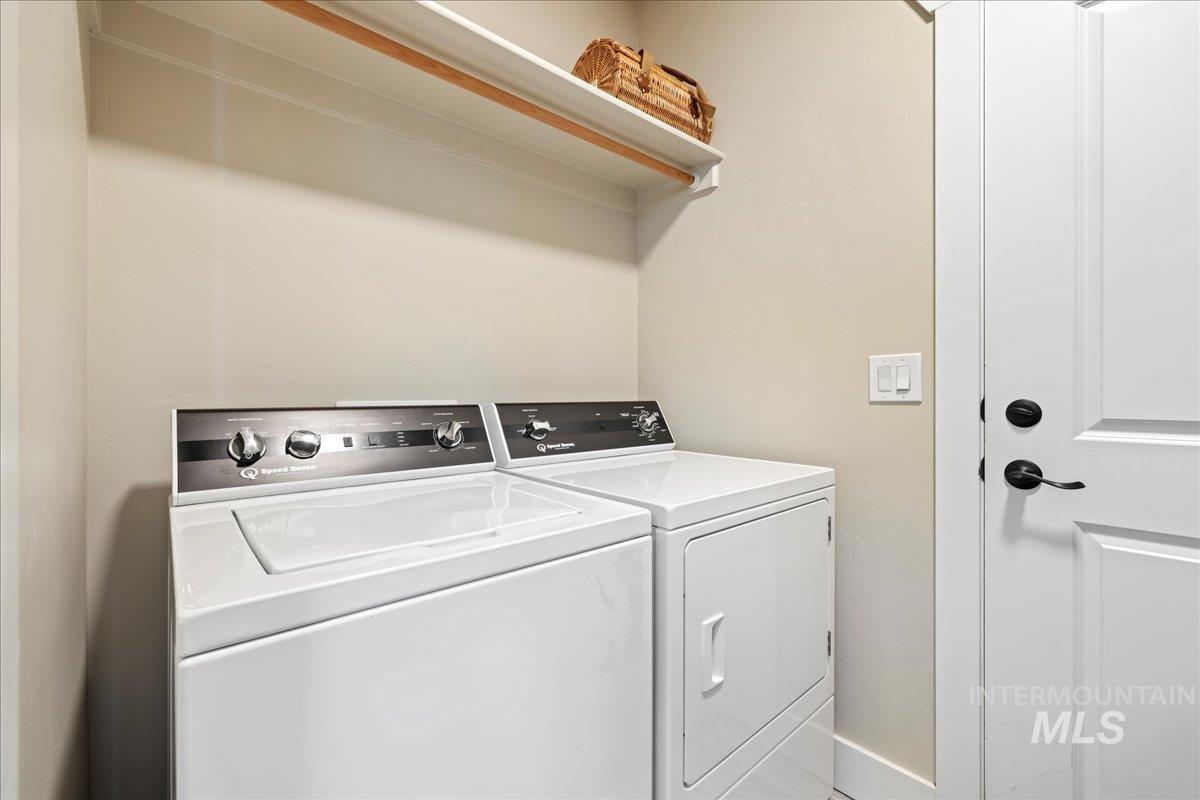 Washroom featuring separate washer and dryer