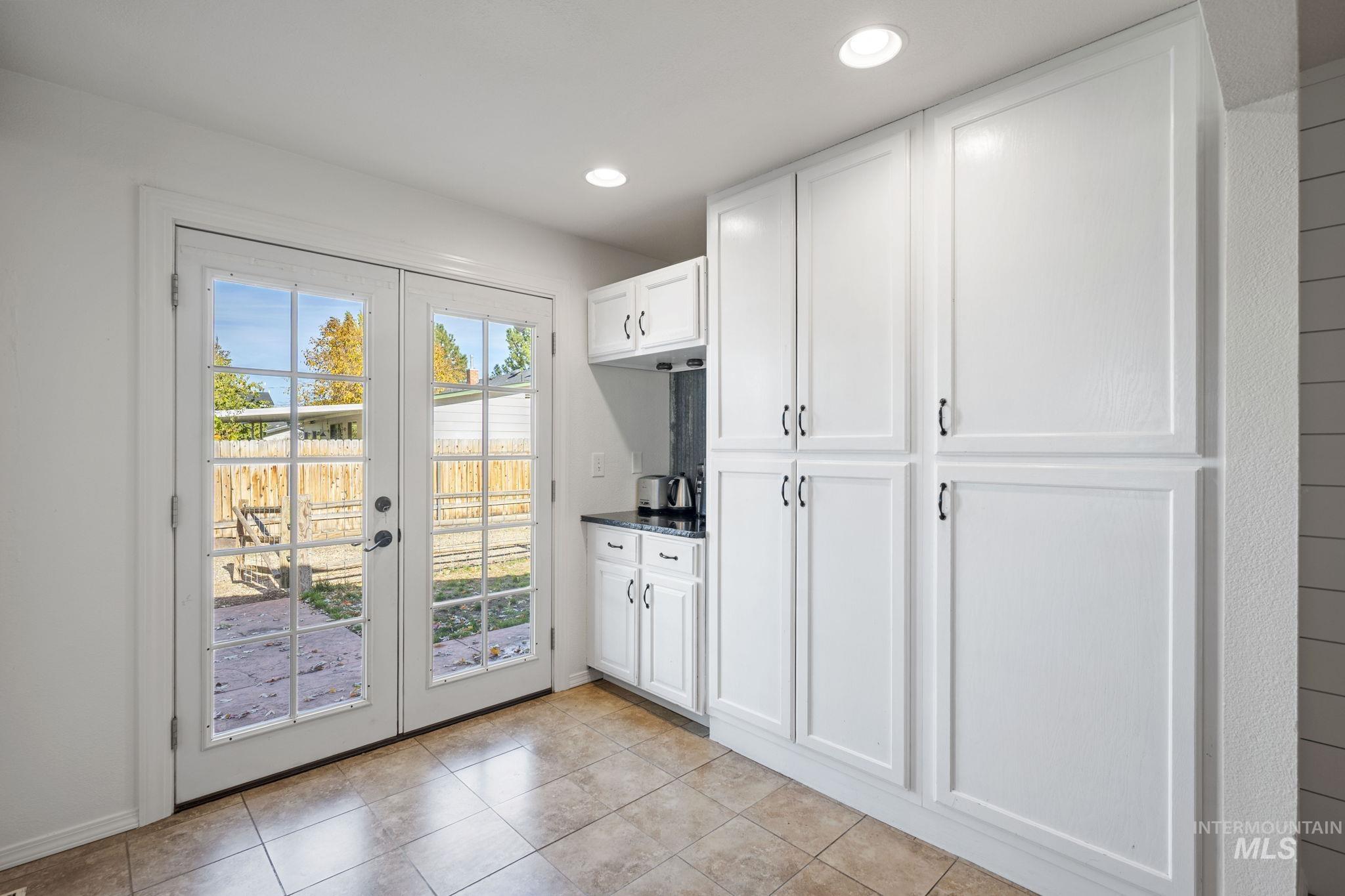 Doorway to outside featuring french doors, recessed lighting, and tile patterned floors