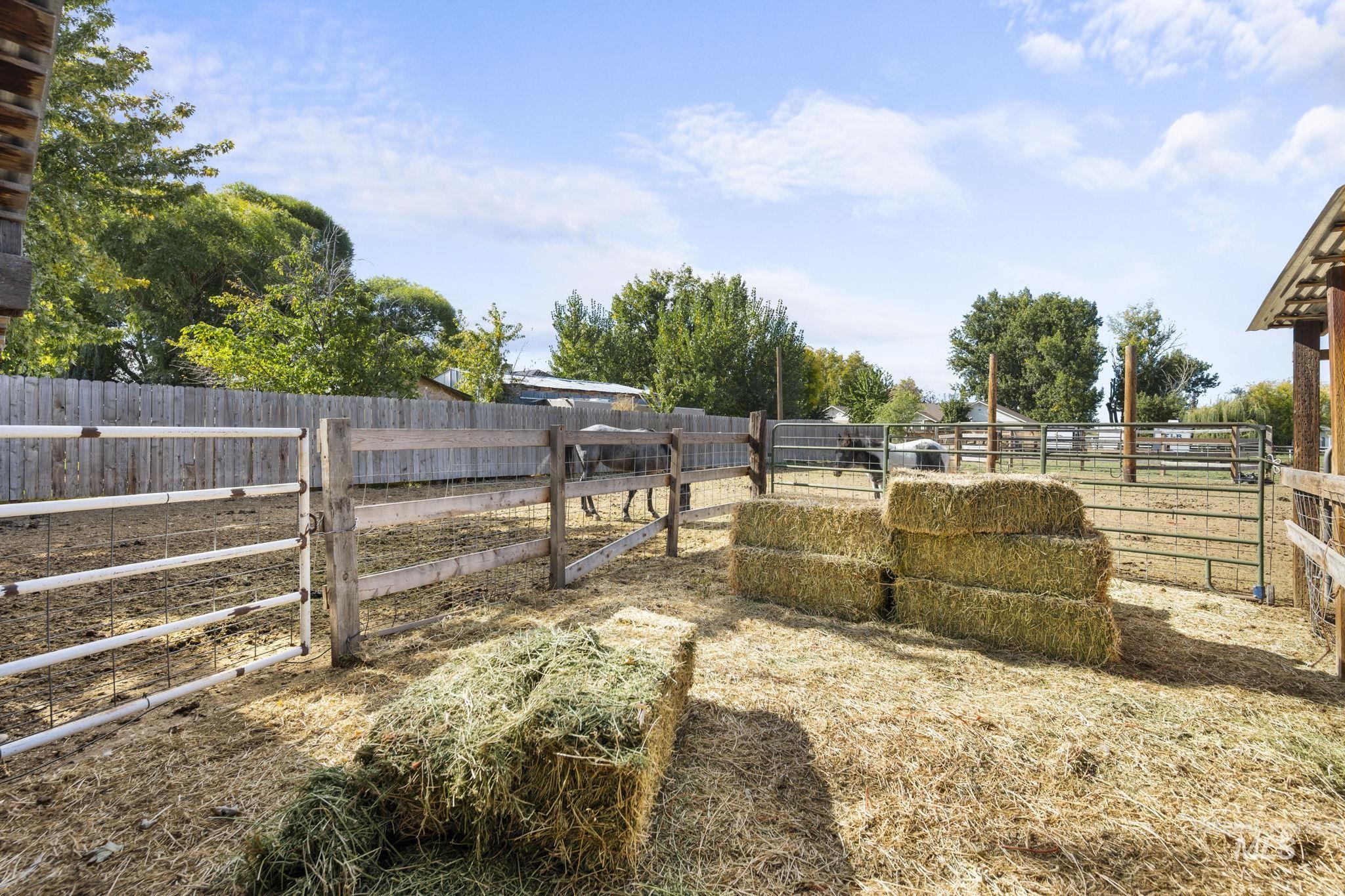 View of yard featuring an outbuilding and an exterior structure