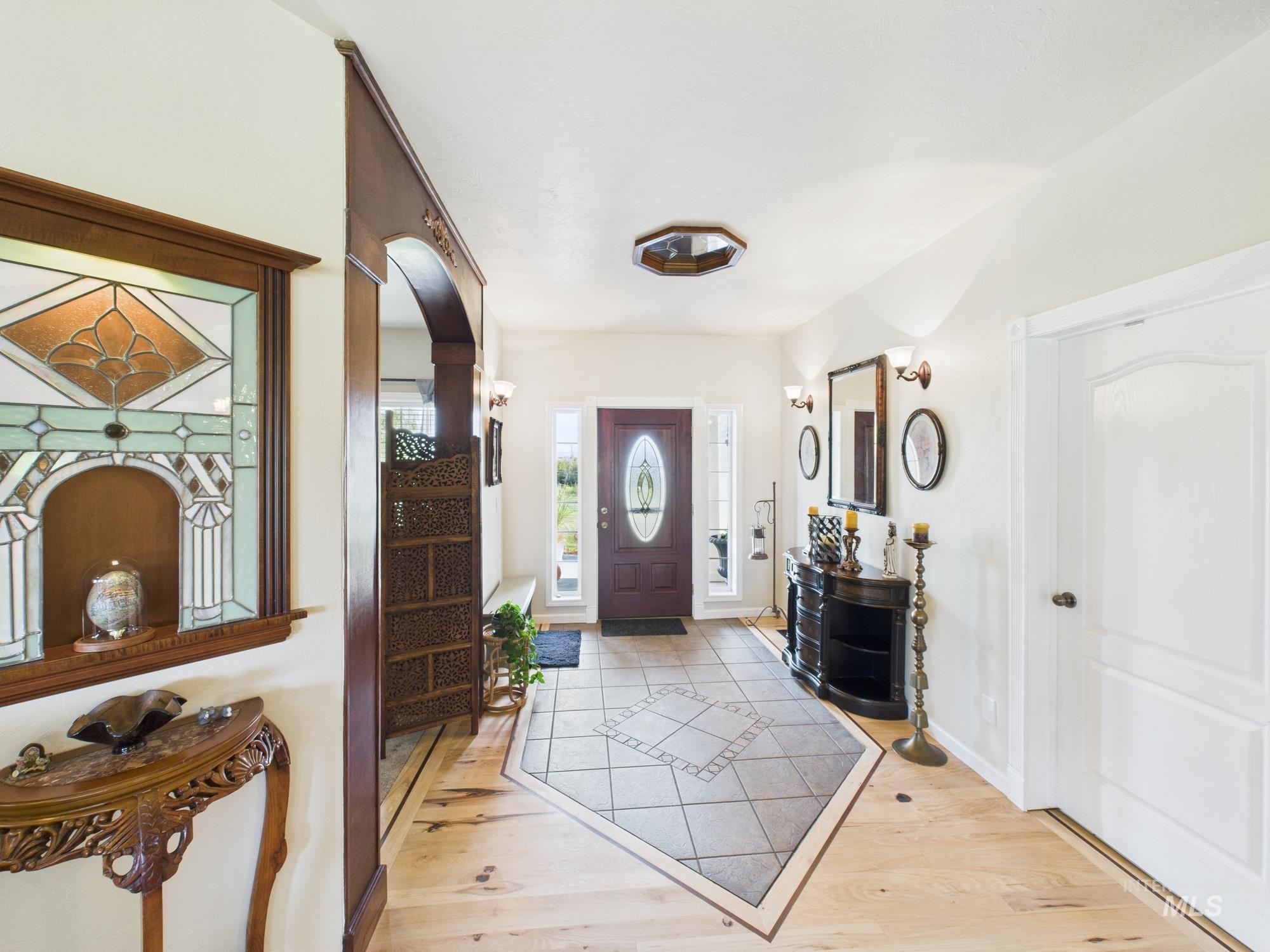 Entrance foyer featuring light wood-style flooring