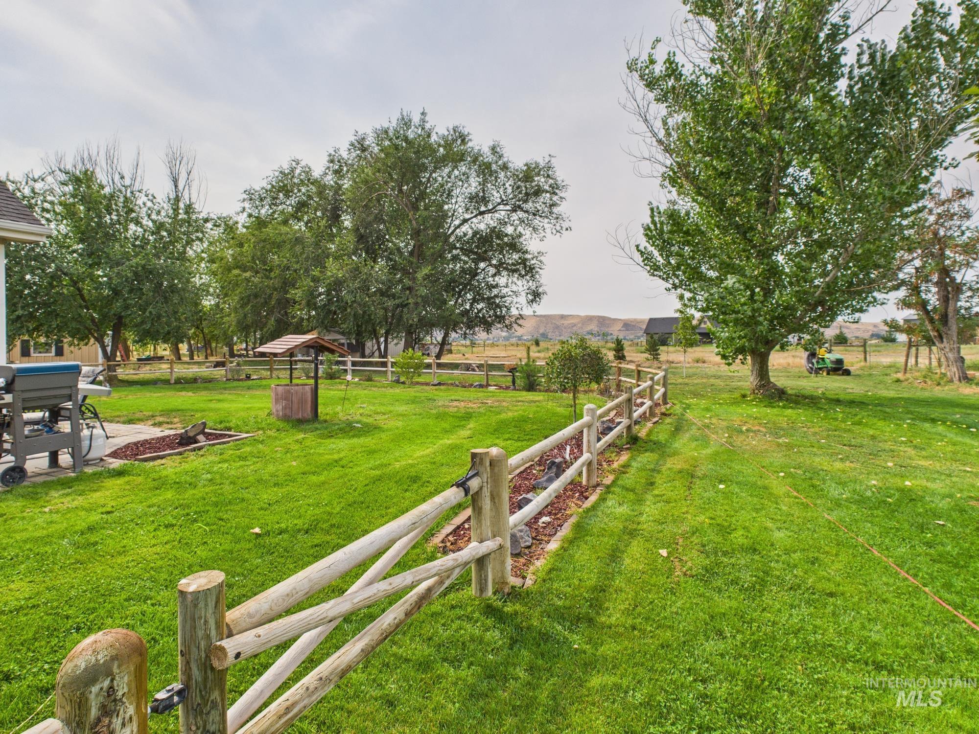 View of yard with a view of countryside and a patio area