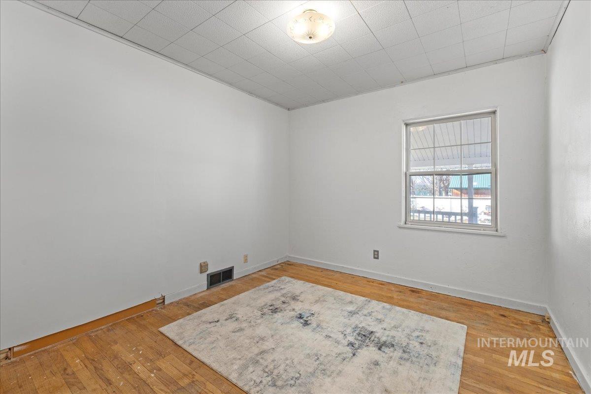 Unfurnished room featuring light wood-type flooring