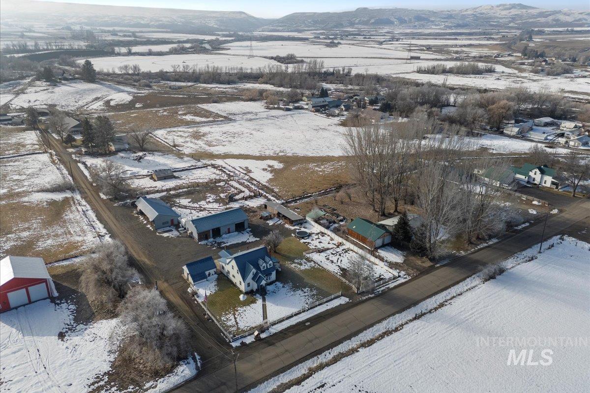 Snowy aerial view featuring a mountain view