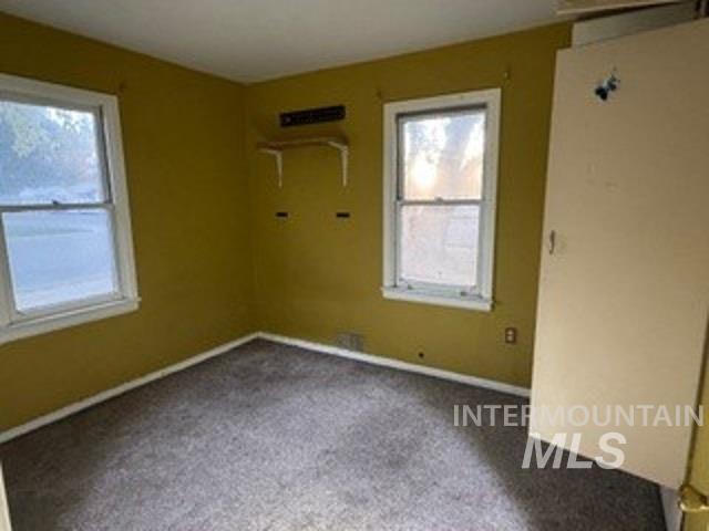 Spare room with carpet flooring and baseboards