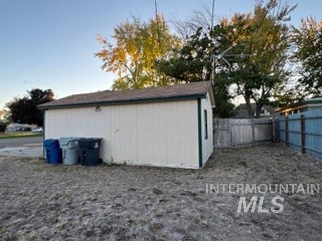 View of outdoor structure with a fenced backyard