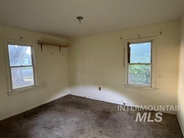 Unfurnished room featuring carpet