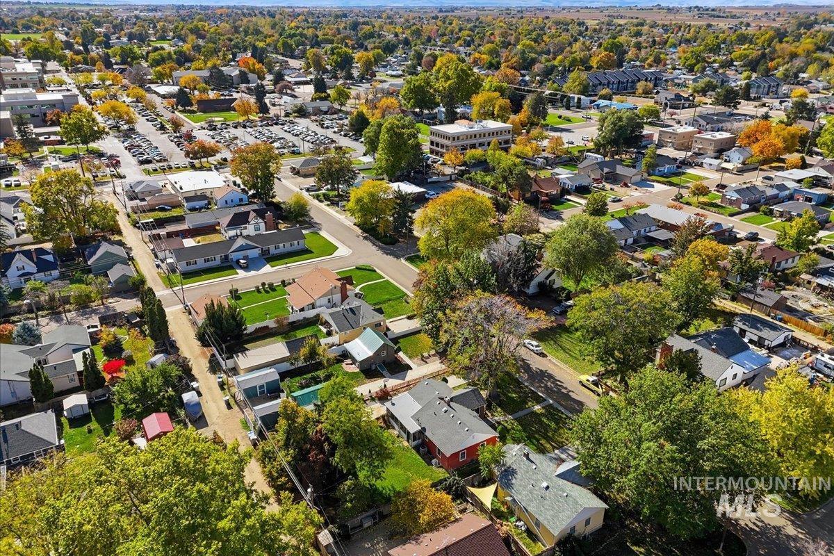 Aerial view of property's location with nearby suburban area