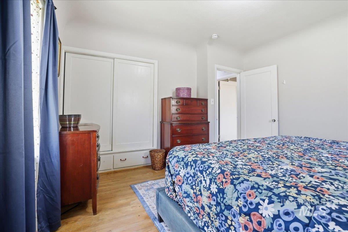 Bedroom featuring light wood-style flooring and a closet