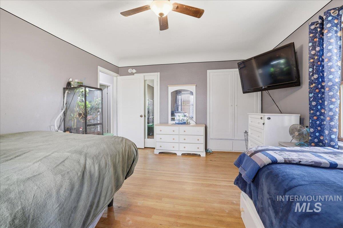 Bedroom featuring light wood-style floors and ceiling fan
