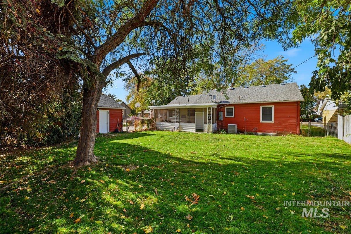 Back of house featuring a sunroom