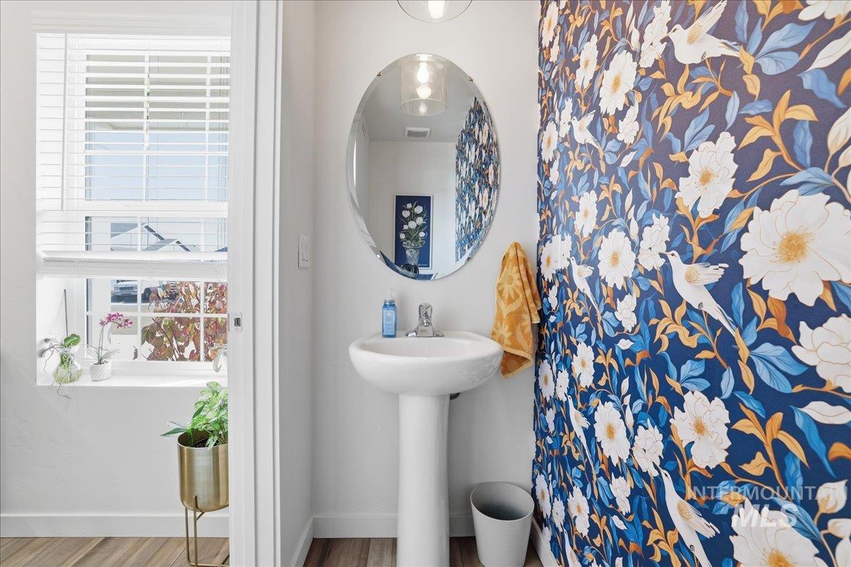 Bathroom with baseboards and wood finished floors