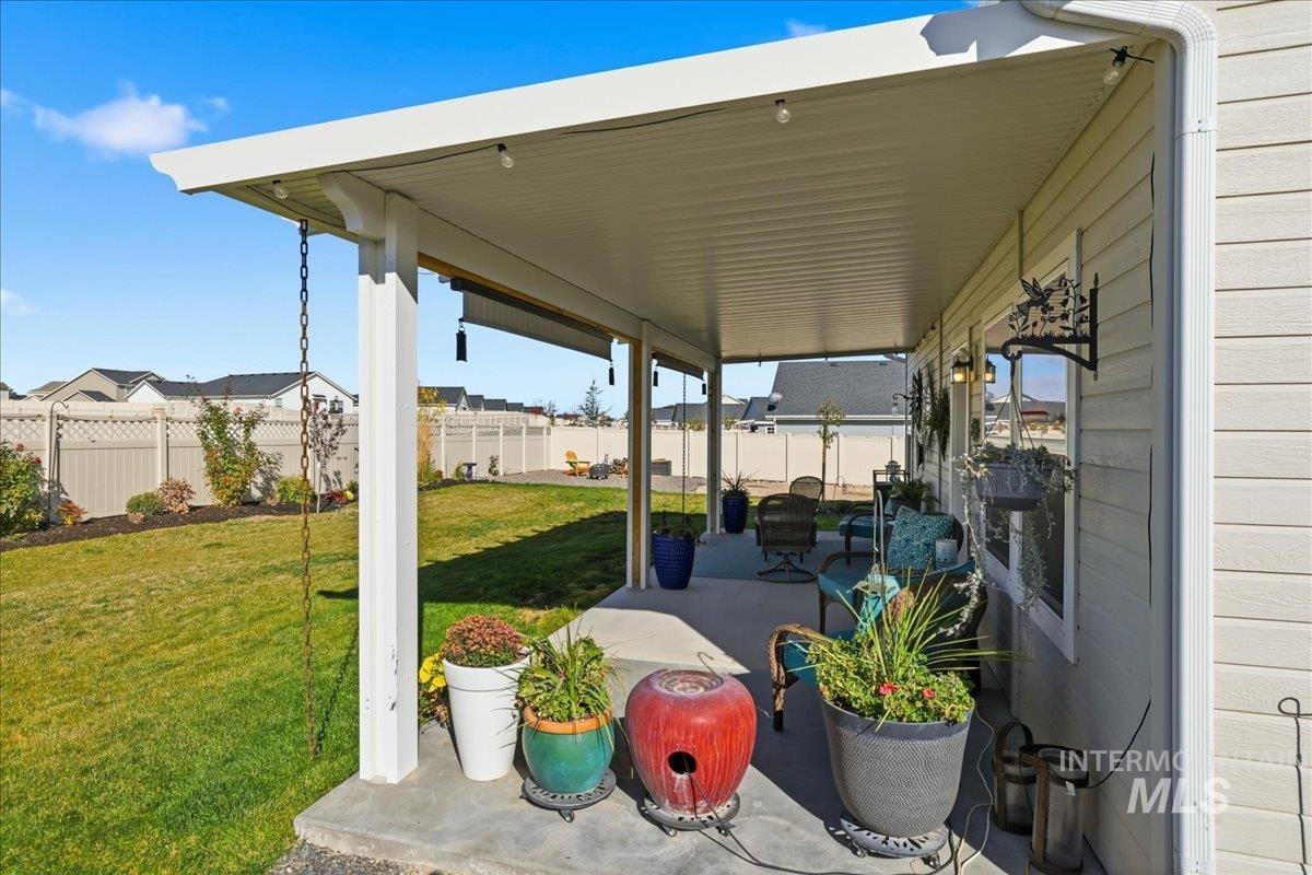 Fenced backyard featuring a patio