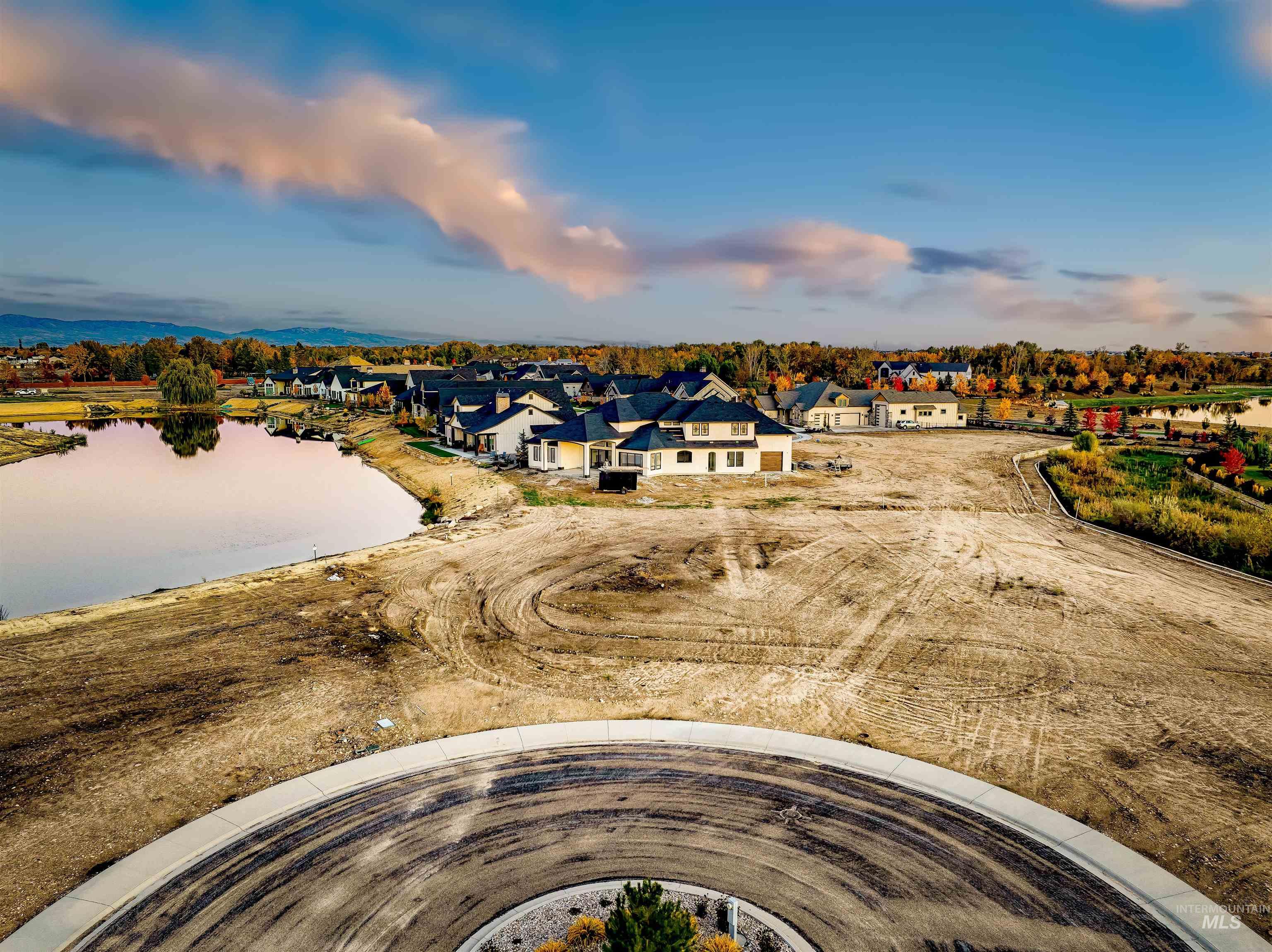 Aerial perspective of suburban area with a nearby body of water