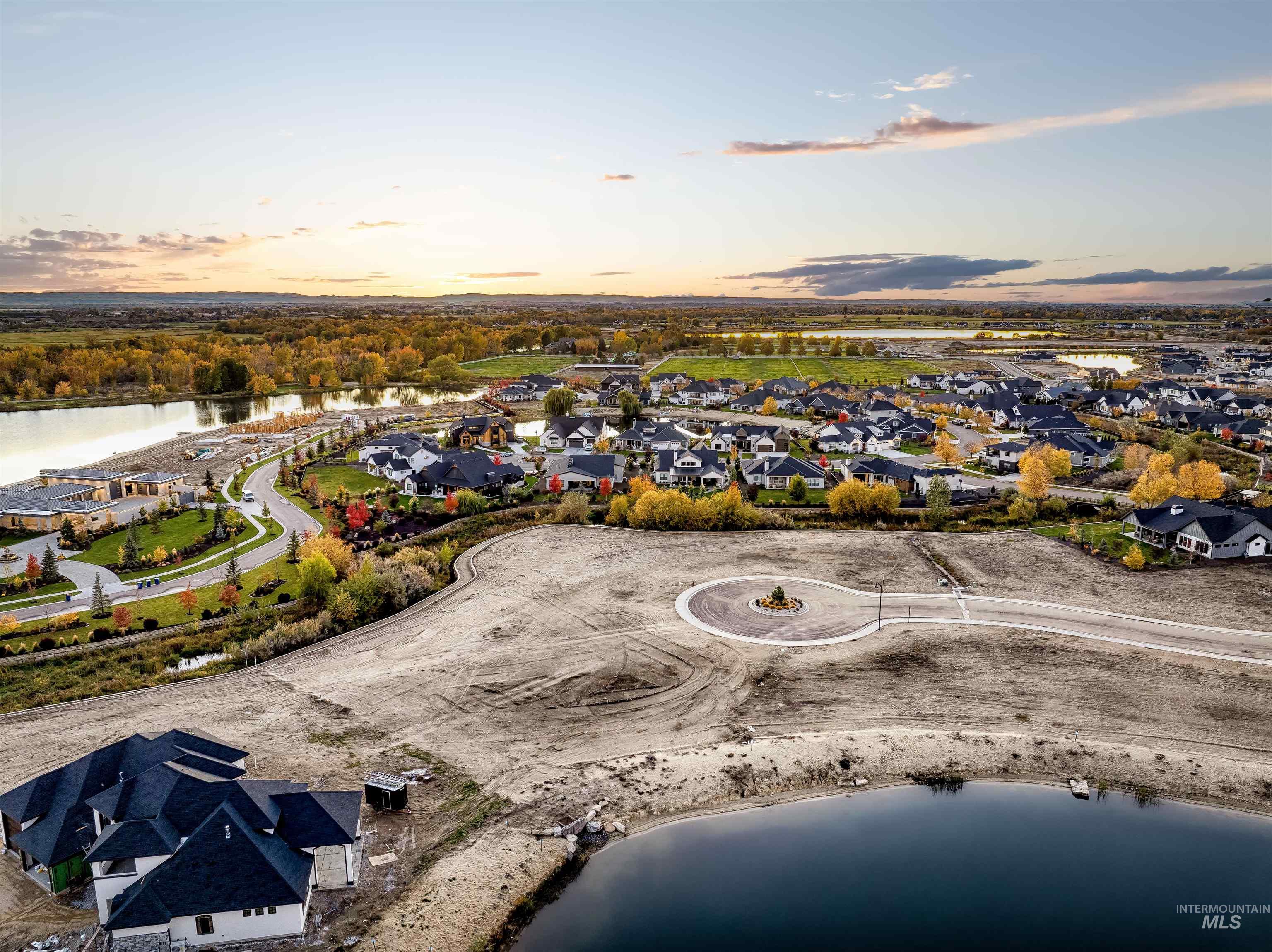 Aerial view of residential area featuring a large body of water