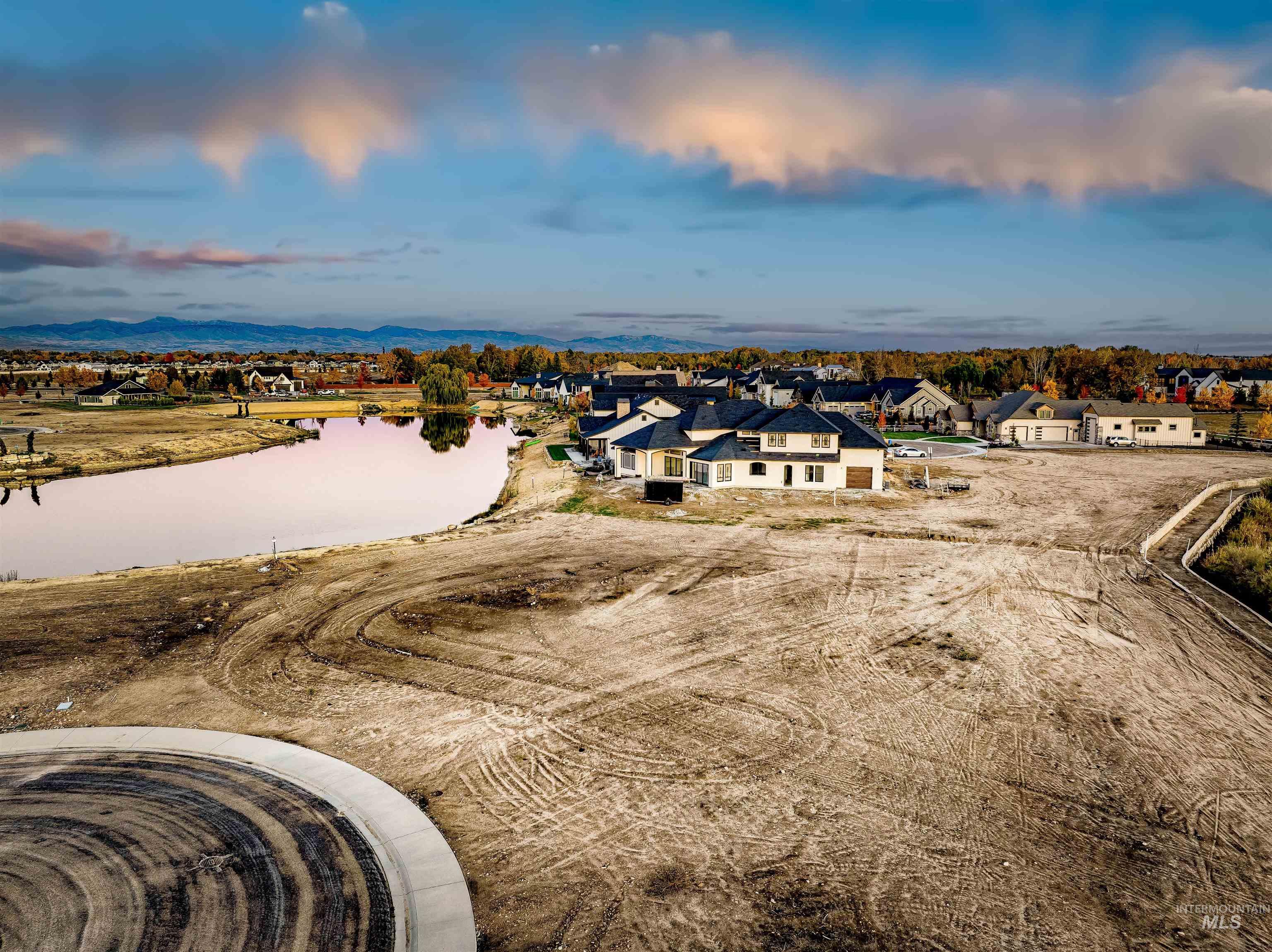 Aerial perspective of suburban area with a nearby body of water