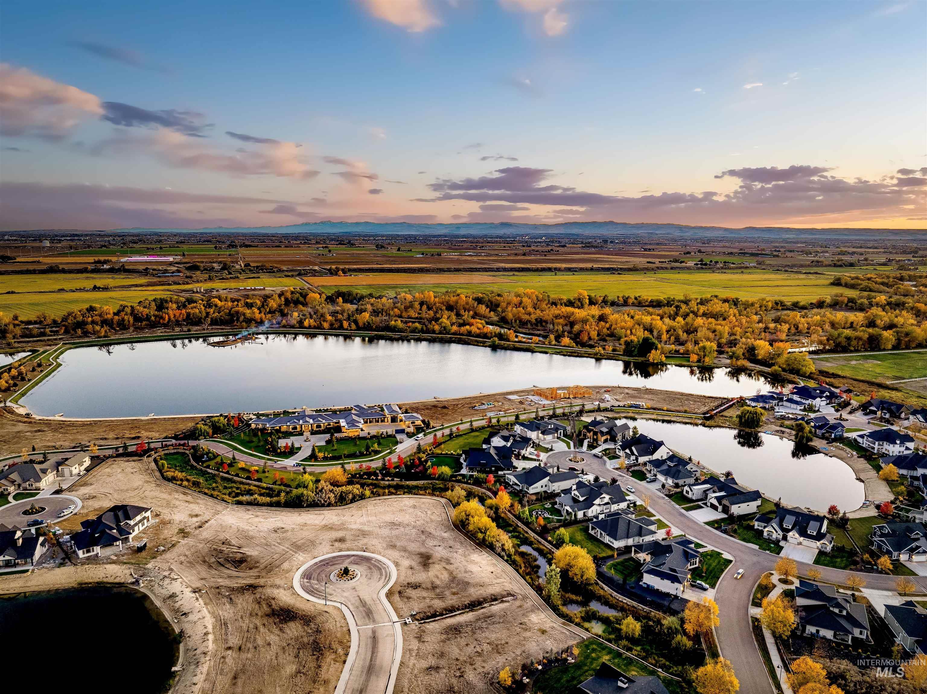 Aerial overview of property's location featuring a large body of water and nearby suburban area