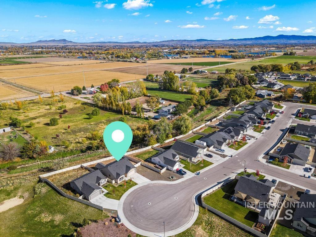 Aerial view of residential area with a mountain backdrop