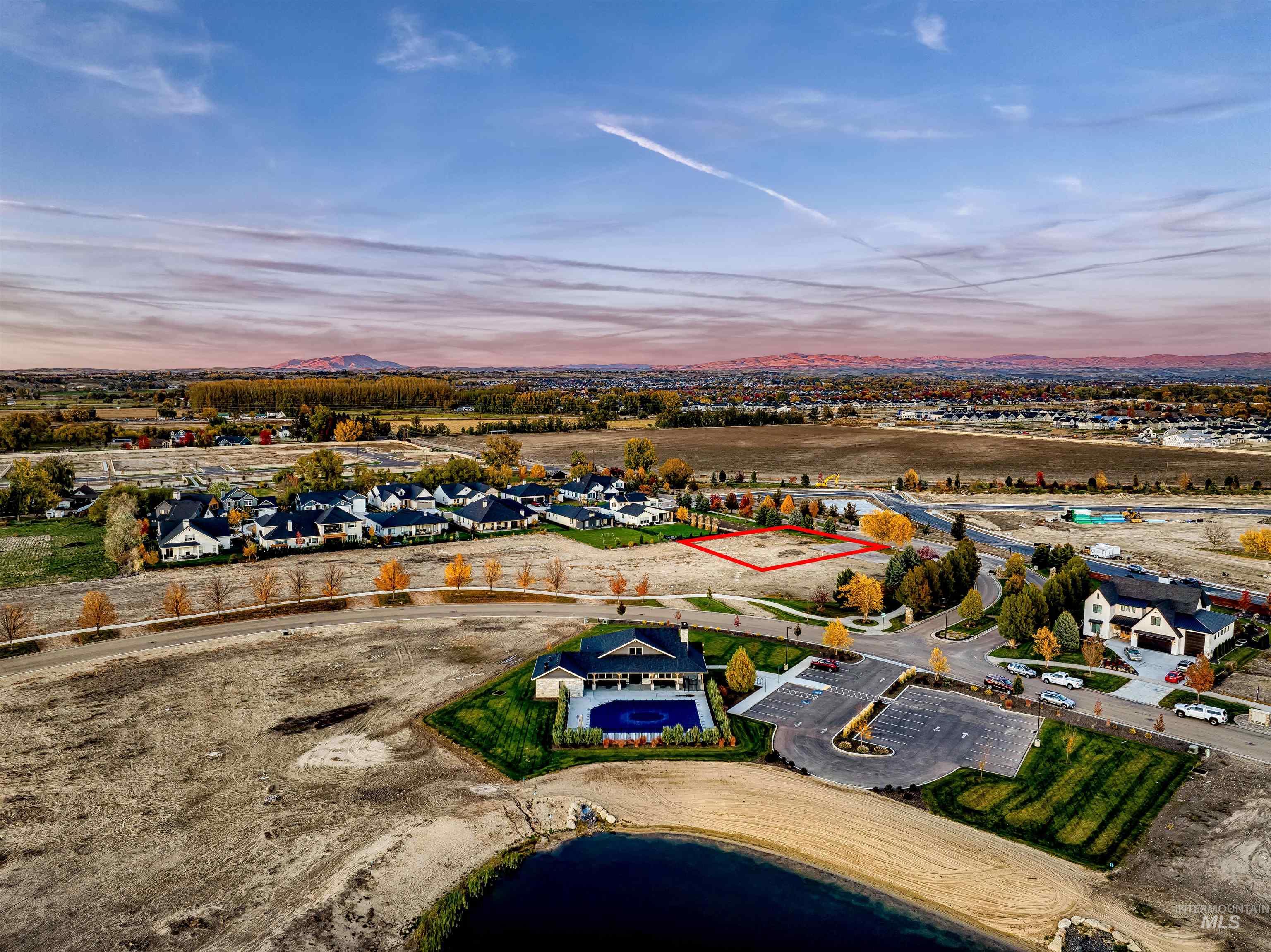 Aerial view at dusk of a water view and a residential view