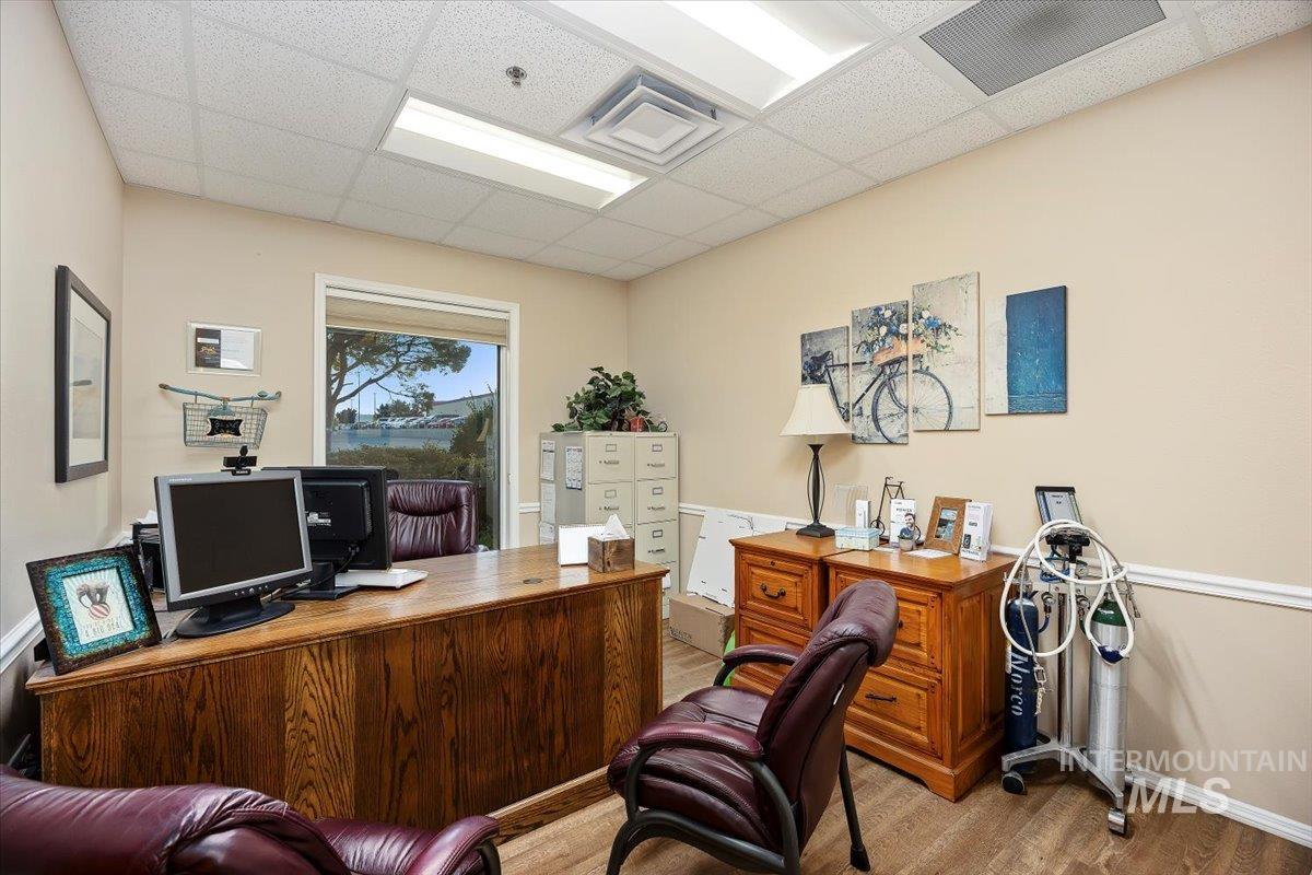 Office area featuring a paneled ceiling