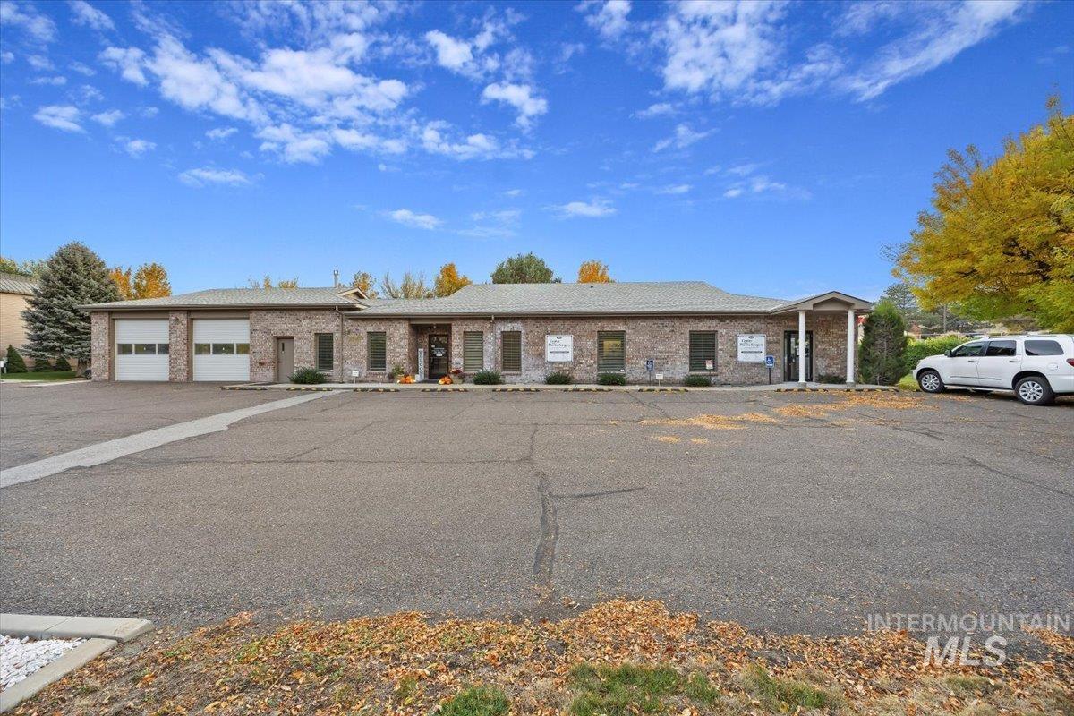 Single story home featuring brick siding