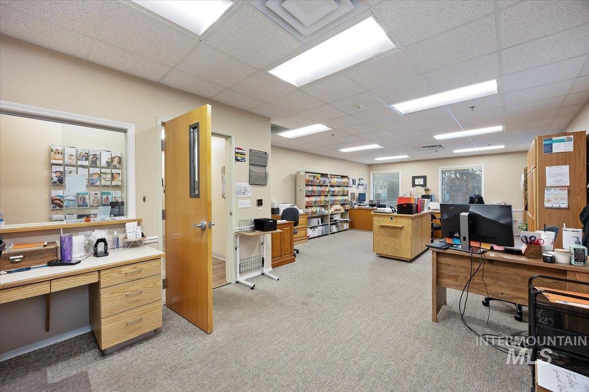 Office space featuring a paneled ceiling