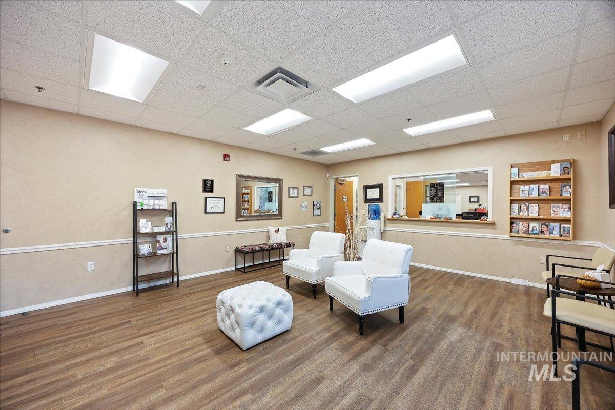 Living area with a paneled ceiling