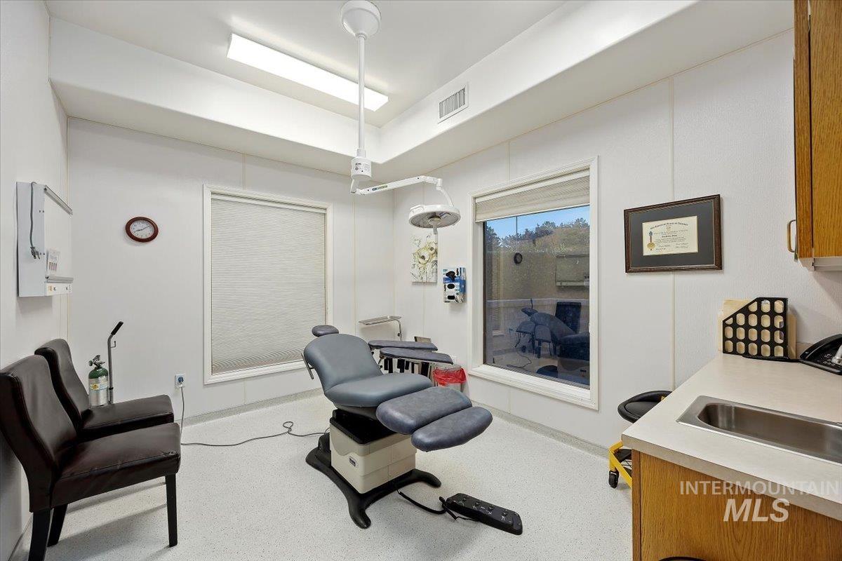 Sitting room featuring baseboards