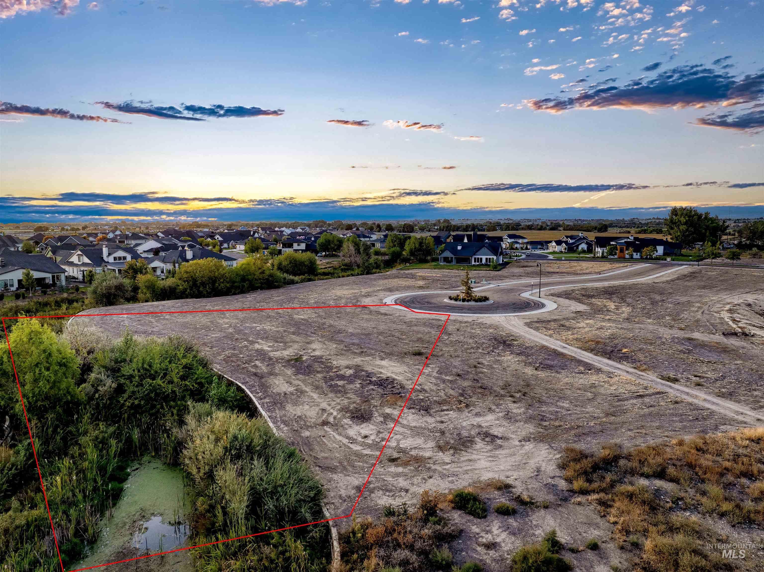 Aerial view of residential area featuring property boundaries highlighted