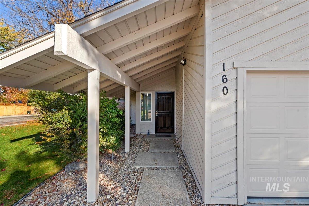 Entrance to property featuring a garage