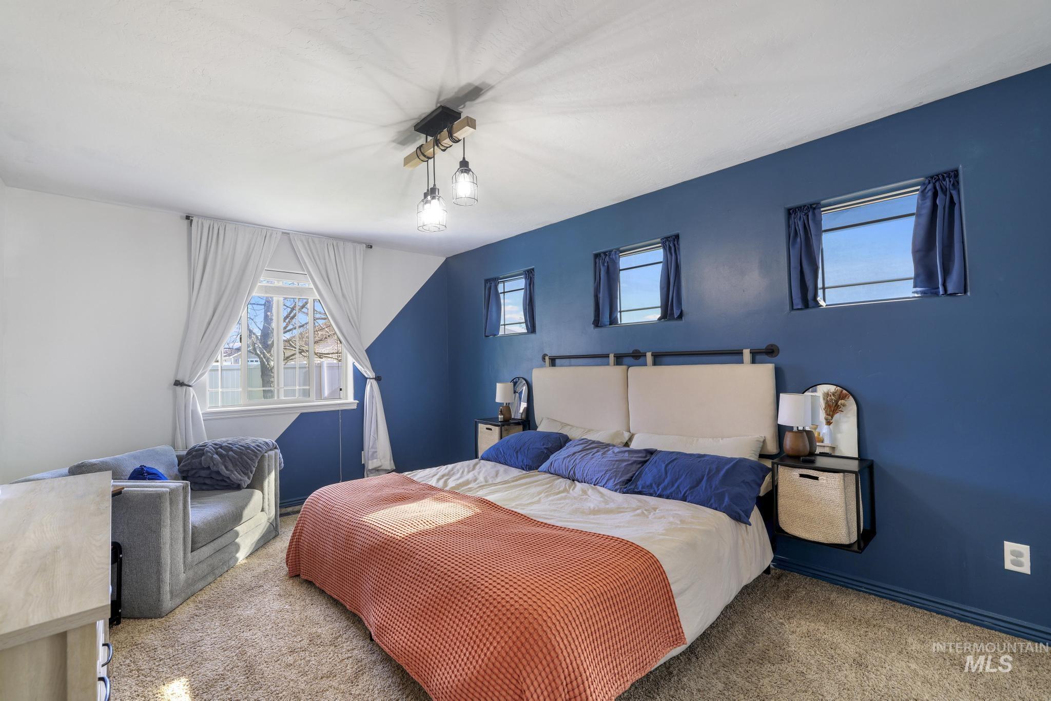 Bedroom with carpet and baseboards