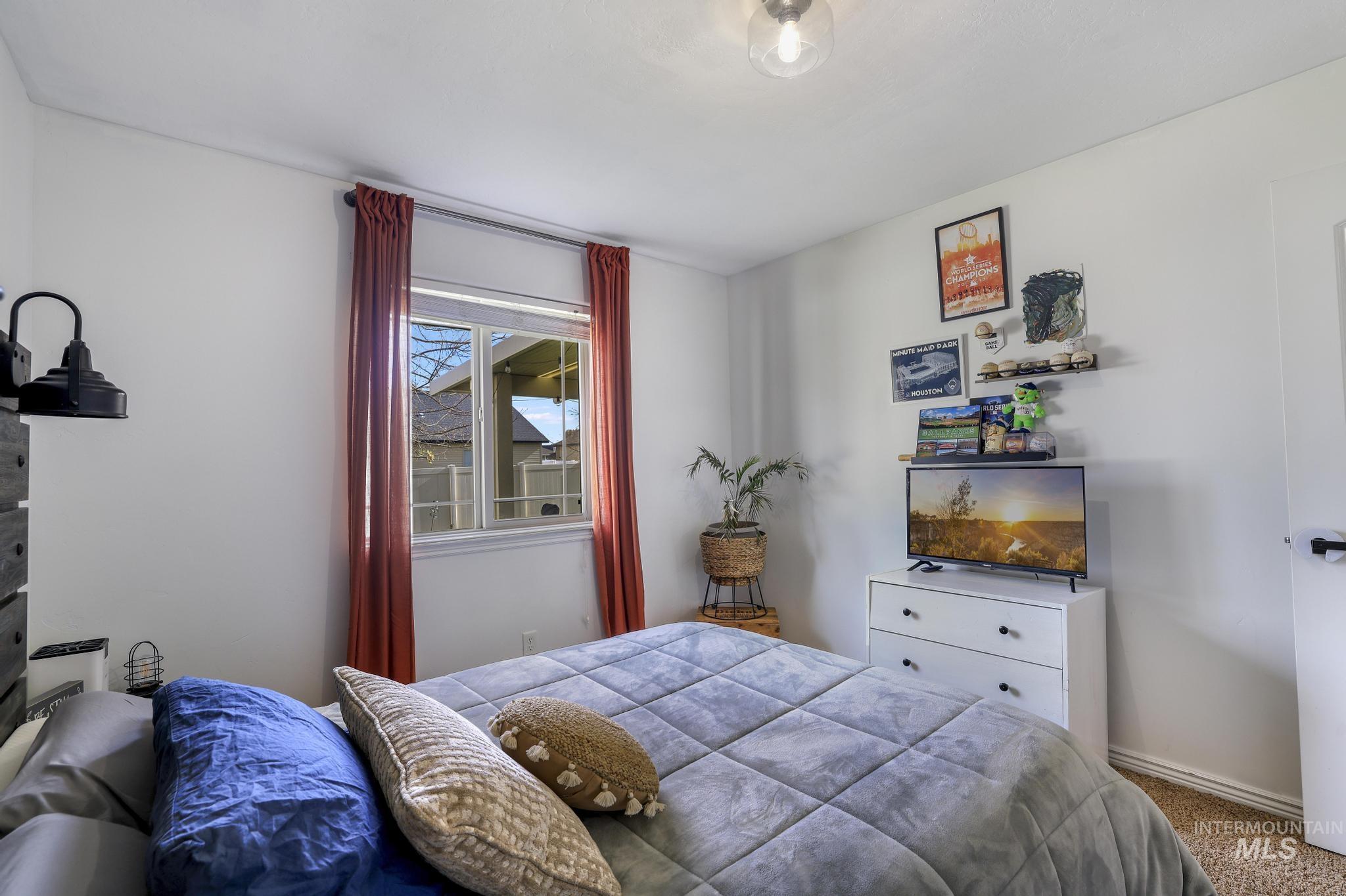 Carpeted bedroom with baseboards