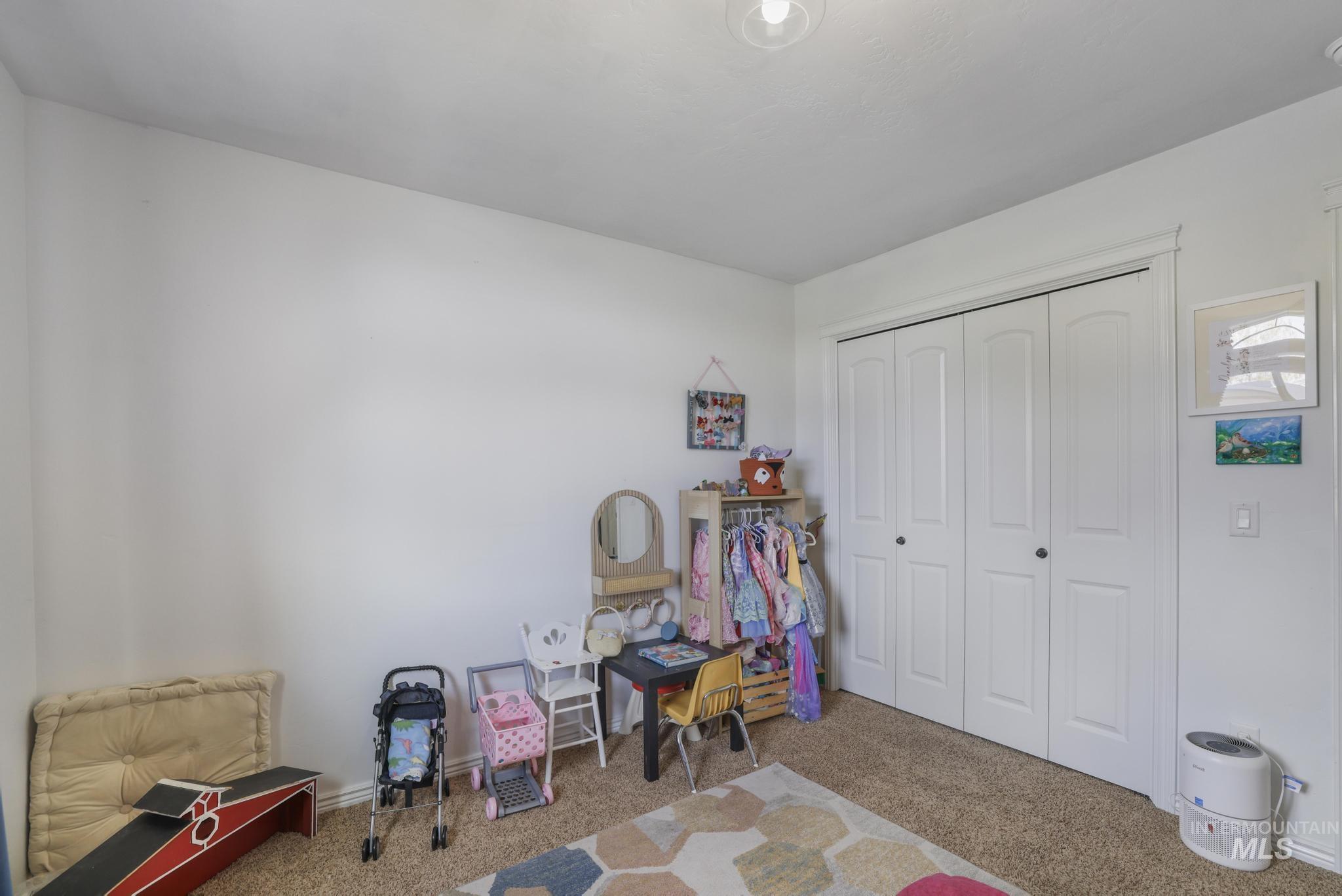 Rec room with carpet flooring