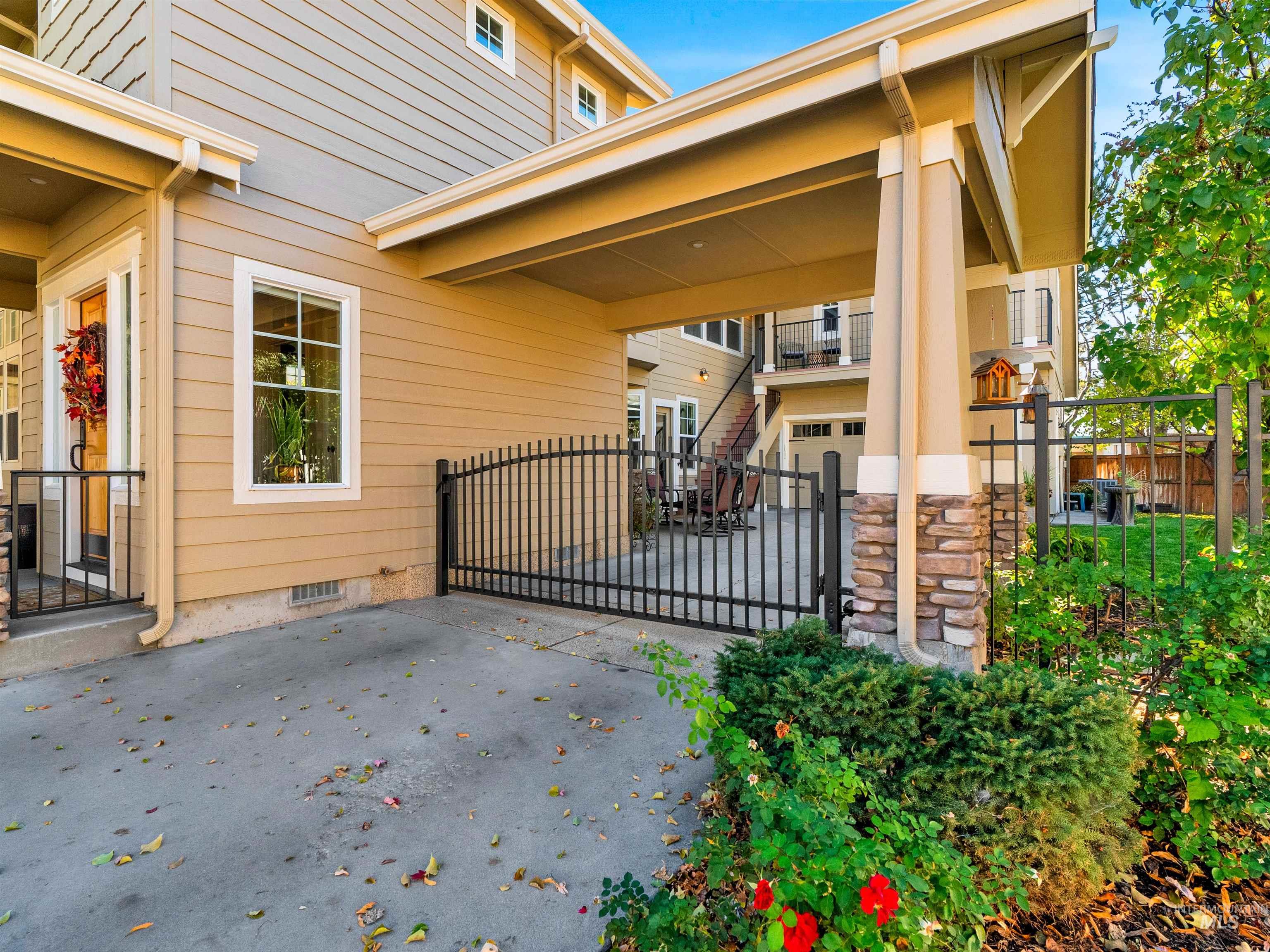 Gate featuring a patio