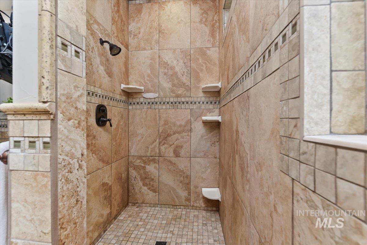 Bathroom featuring a tile shower