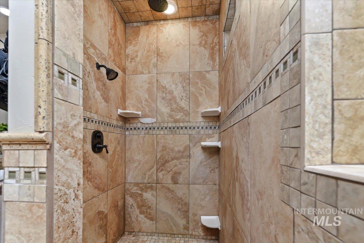 Bathroom featuring tiled shower